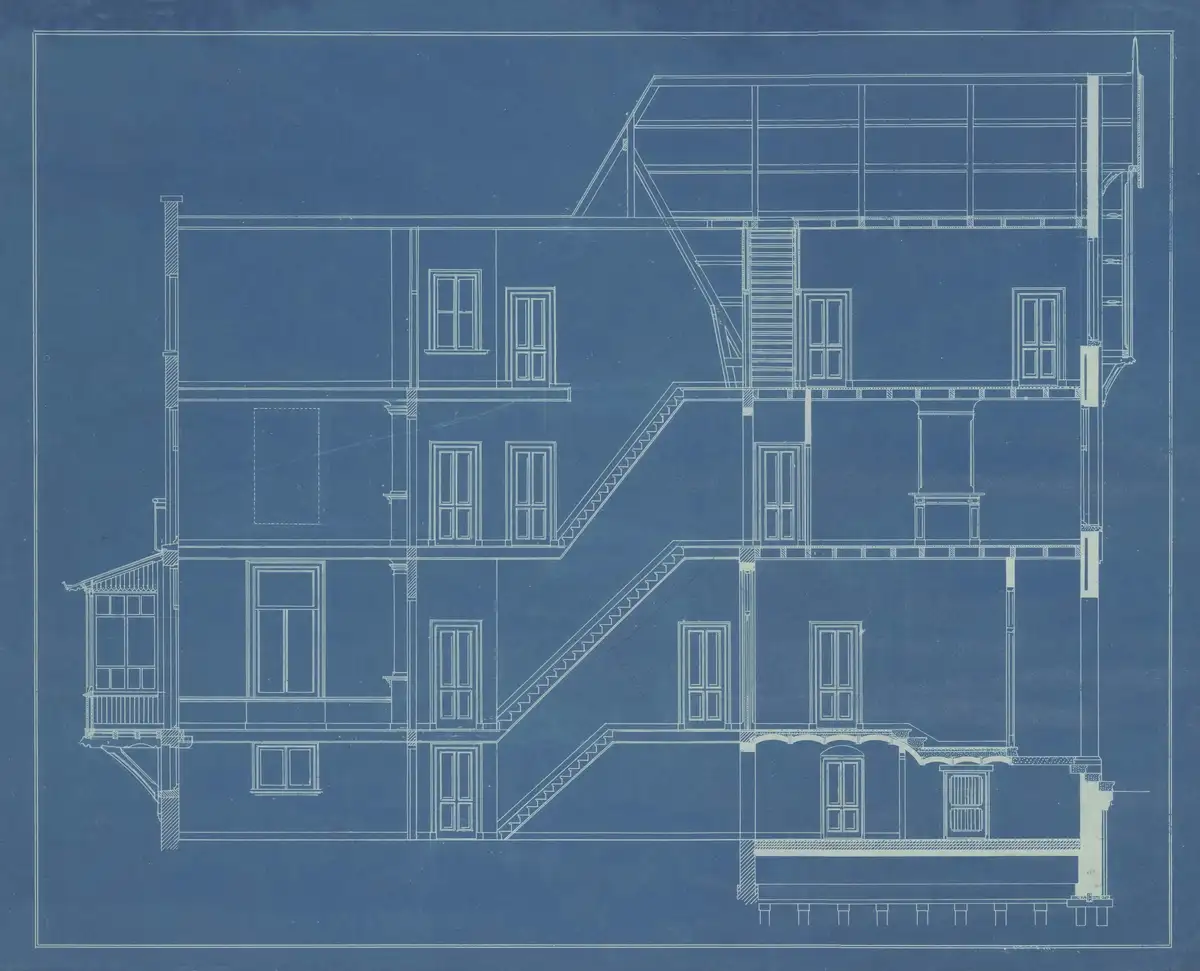 A cyanotype architectural cross-section: floor plates, stair runs and a rooftop steel frame drawn in fine white line on deep blue.